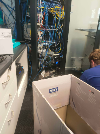 Server cabinet full of random cabling, very dishevelled